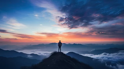 Tuinposter Silhouette of a man on the mountain top Sunset among the clouds © somchai20162516