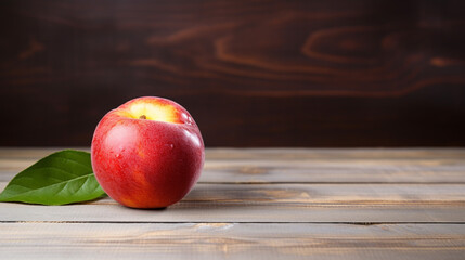 Fototapeta na wymiar Photograph of a Delicious Nectarine on a Wood Background