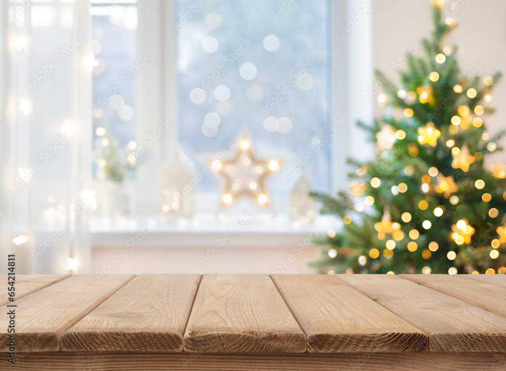 Wall mural empty table in front of christmas tree with decoration background