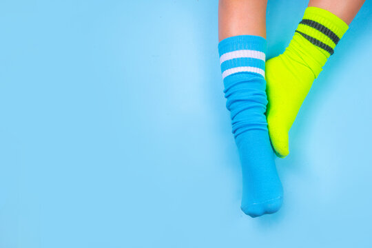 Child legs in mismatched socks