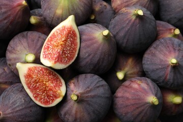 Fresh ripe figs as background, top view