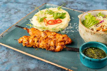 chicken with cheese with mashed potatoes and salad