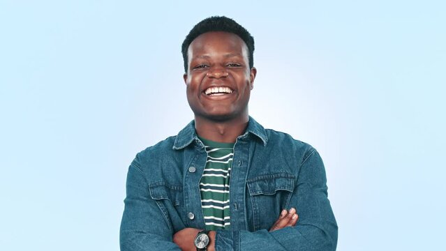 African man, laughing and arms crossed in studio by blue background, happiness and smile portrait. Black guy, fashion and funny with confident in body language, comedy and laughter in mockup