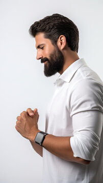 side angle of a male technology expert wearing a professional shirt looking at the digital watch on his wrist on a white background created with Generative AI Technology