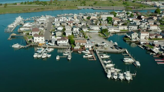 Aerial drone. Local residential suburb of river in view of distant Long Beach. USA , Wide futage