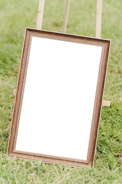 Mockup frame close up at a street fair or flea market on the grass