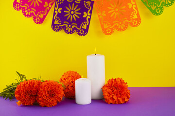 Marigold flowers and candles used for Mexican altars at day of the day