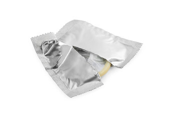 Torn package with condom isolated on white. Safe sex