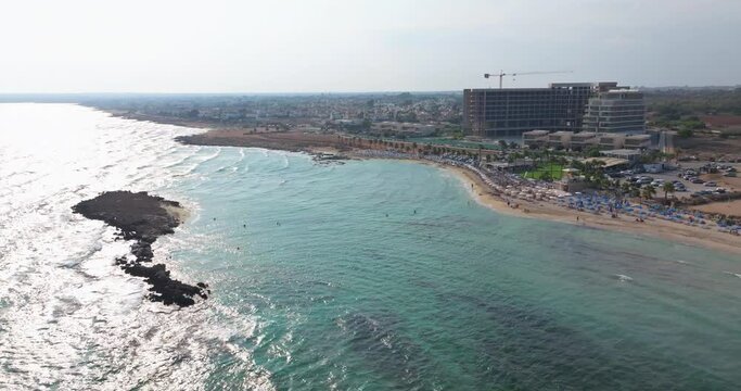 Aerial view of Nissi beach in Ayia Napi, Cyprus. Beautiful beaches, resorts and hotels on the coastline of the island. High quality 4k footage