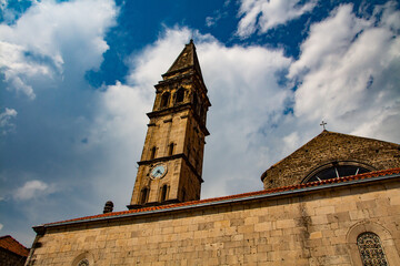 Fototapeta na wymiar Bell tower of St Nicholas church in Perast, Montenegro