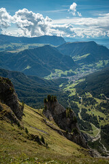 Fototapeta premium The side landscape view with a wide-angle lens from the top of Seceda mountain in Dolomites, Italy , sunset time