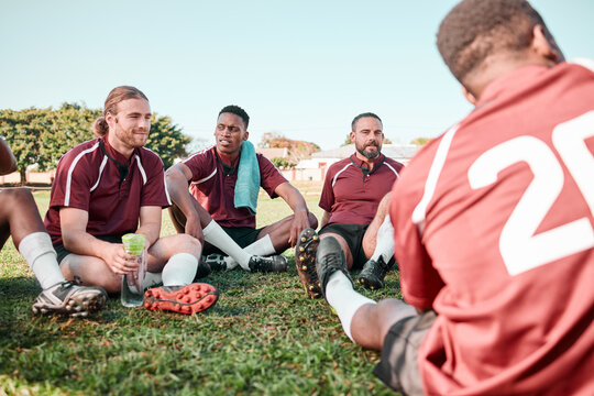 Fitness, people and rugby players in at training for planning strategy for game or match. Sports, huddle and athletes talking for group teamwork and workout on an outdoor field for practice together
