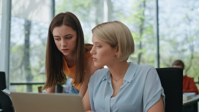 Young intern asking leader woman coworking closeup. Supervisor explaining office