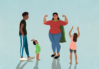 Happy family cheering for confident mother in superhero cape