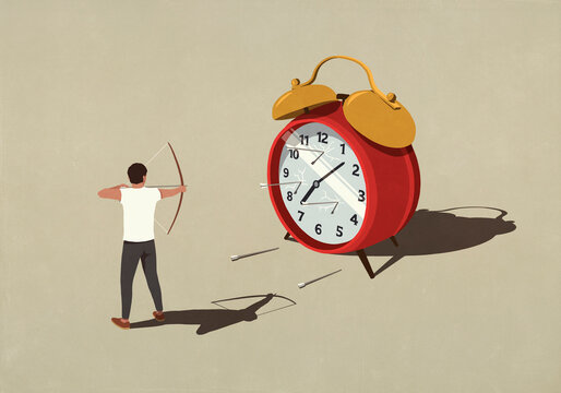 Man shooting arrows at large alarm clock
