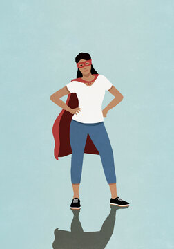 Portrait confident woman in superhero costume
