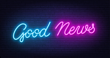 Good News neon lettering on brick wall background.