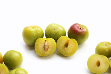 Fresh green plum fruit on white background.