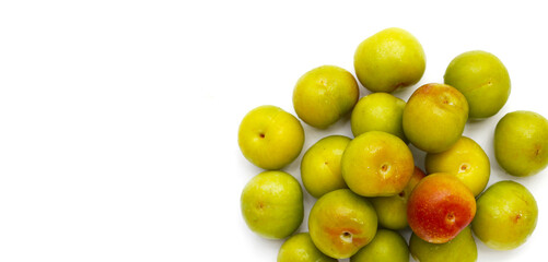 Fresh green plum fruit on white background.