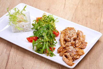 meat with salad and rice