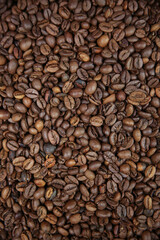 Overhead view of backdrop representing halves of dark brown coffee beans. Texture of coffee beans 
