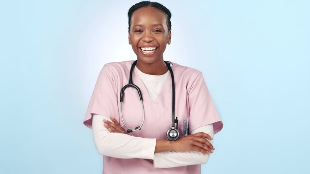 Happy, black woman and professional doctor with arms crossed against a studio background. Portrait of African female person, medical or healthcare nurse smile in confidence for health advice