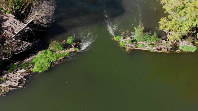 Flying along a beautiful river with rapids and curved banks. Early fall or summer. 