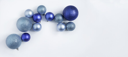 blue Christmas balls on a white background. view from above.