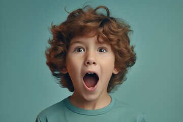 A young boy with a surprised expression on his face. Perfect for capturing genuine emotions.