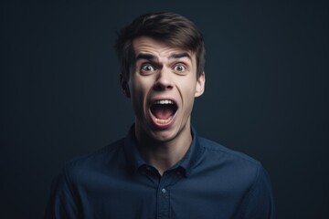 A man with a surprised look on his face. Suitable for illustrating shock, surprise, or unexpected situations.