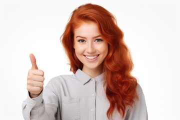 A woman with vibrant red hair is seen giving a thumbs up gesture. This image can be used to convey approval, positivity, or success in various contexts. - obrazy, fototapety, plakaty
