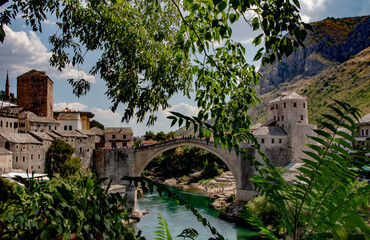 Mostar Bridge or Stari Most and the crowds of tourists or visitors or people on it.