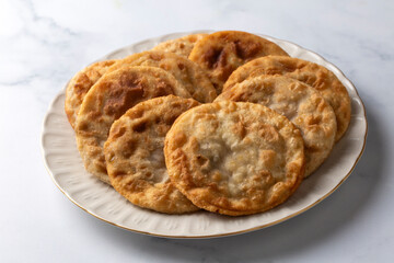 Delicious meat pie from Turkish cuisine. Fried handmade pies. Turkish name; fincan boregi or puf borek