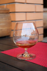 Glass of cognac on the table