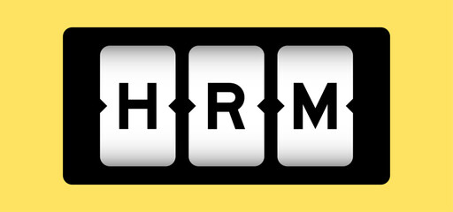 Black color in word HRM (Abbreviation of human resource management) on slot banner with yellow color background