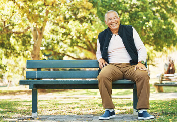 Park, happy and portrait of old man on bench outdoor for fresh air, wellness and relaxing in retirement. Smile, peace and elderly person sitting in nature for calm, freedom and and enjoy weekend