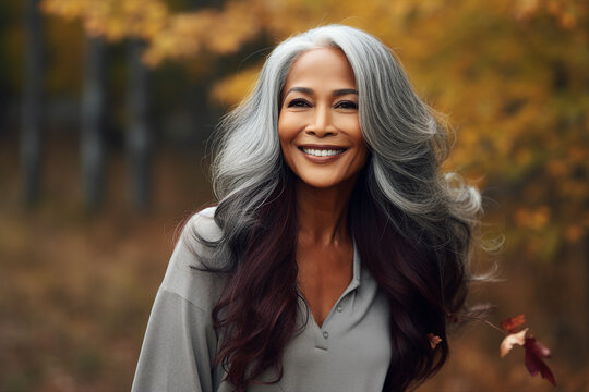 Generative AI technology picture of gorgeous grey haired woman walking autumn park