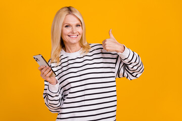 Photo of positive attractive retired lady using device web shopping make thumb up symbol isolated bright color background