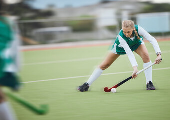 Obraz premium Hockey, athlete and woman running in game, tournament or competition with ball, stick and action on artificial grass. Sports, training and women play in exercise, workout or motion on the ground