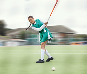 Hockey, sports or woman in a training game, tournament or competition with ball, stick or action on...