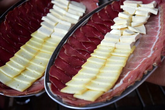 Montenegrin traditional food, Prshut and cheese on a metal tray