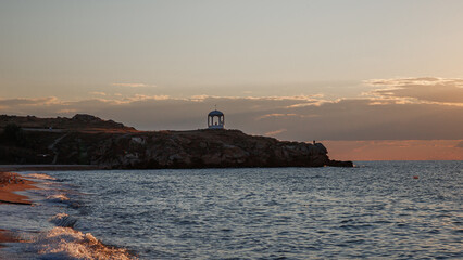 Rocky coastline. The waves break on the rocks. Beautiful landscape. The sky is the sea and the...