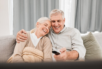 Senior couple, tv and laughing with love on a living room sofa with smile and movie at home....