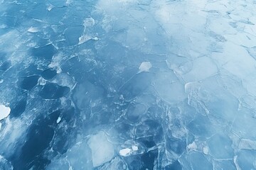 A drone perspective capturing a frozen lake with icy textures - obrazy, fototapety, plakaty