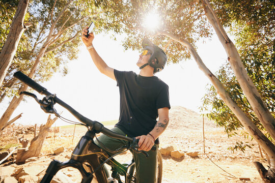 Bicycle, selfie and man with fitness, outdoor and social media with exercise, post and lens flare. Person, athlete and biker with photography, cycling and workout with influencer, sports or internet