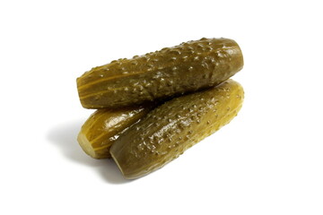   Three pickled cucumbers lie on a white background.