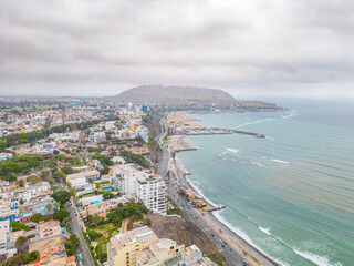 Fototapeta premium Aerial view of the Pacific Ocean next to the Barranco neighborhood in Lima, Peru in 2023.
