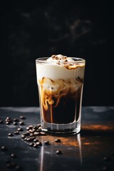 Iced milk coffee on moody background.