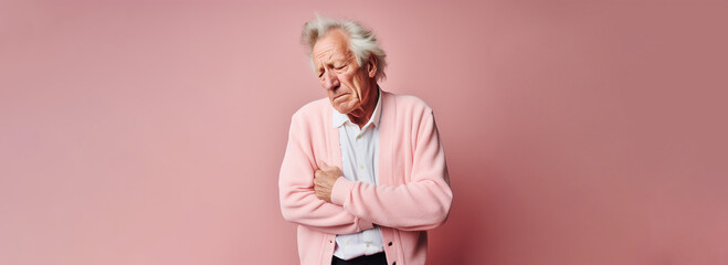 Old man holding stomach with discomfort from gastritis on pink background - obrazy, fototapety, plakaty