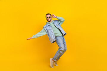Full body size photo of cool dance youngster boyfriend chill positive careless tiptoes vibe clubbing isolated on yellow color background